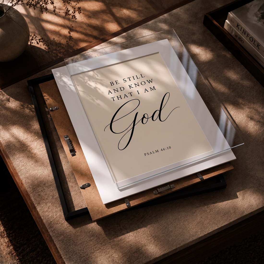 Psalm 46:10 framed wall art shown with frame backing and clear cover