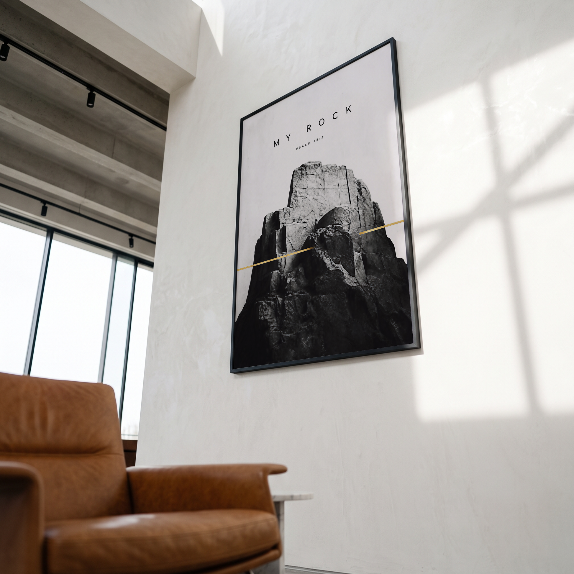 My Rock Psalm 18:2 strength and refuge Scripture art above a sofa in a living room.